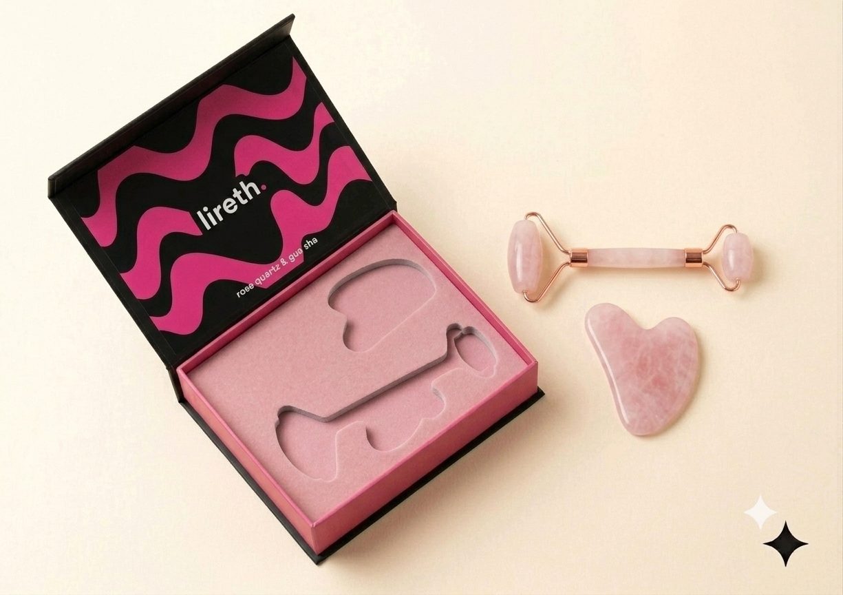 lireth. box open beside the rose quartz roller and gua sha stone